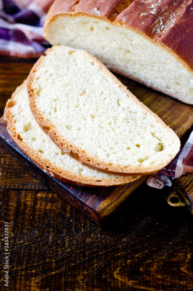 Homemade bread on a dark wooden background