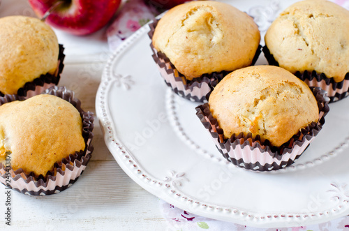 Apple muffins on a white wooden background