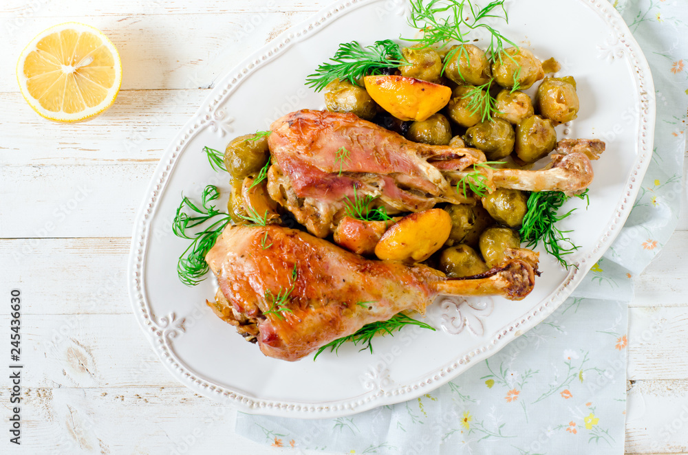 Baked turkey legs with Brussels sprouts and lemon
