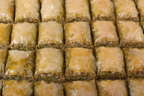 Baklava with a lot of pistachios on the table