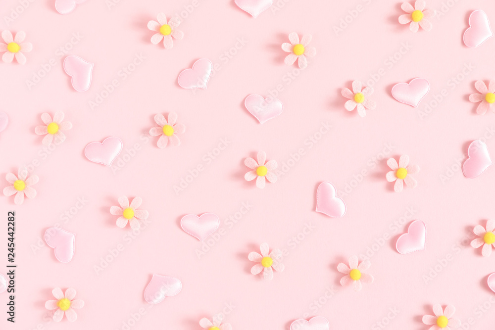 Valentine's Day background. Floral decor and pink hearts on light pink pastel background. Valentines day concept, design. Flat lay, top view, copy space 
