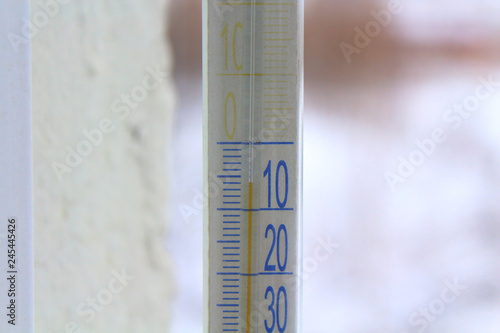 Outdoor thermometer on the window. Close-up. Background.