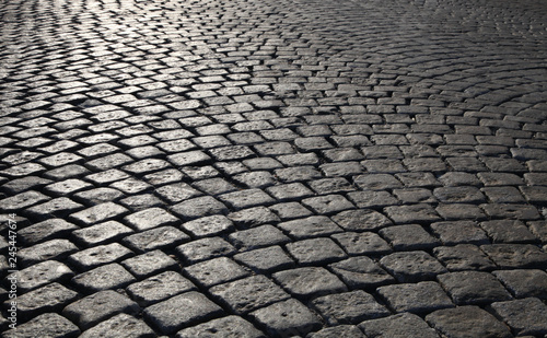 cobblestone walkway in the city;