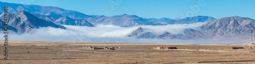 The Camanchaca  Humidity from the sea  creates morning clouds at Atacama Desert altiplano  amazing arid and dry landscape with life because of humidity coming from the sea. Life in extreme conditions 