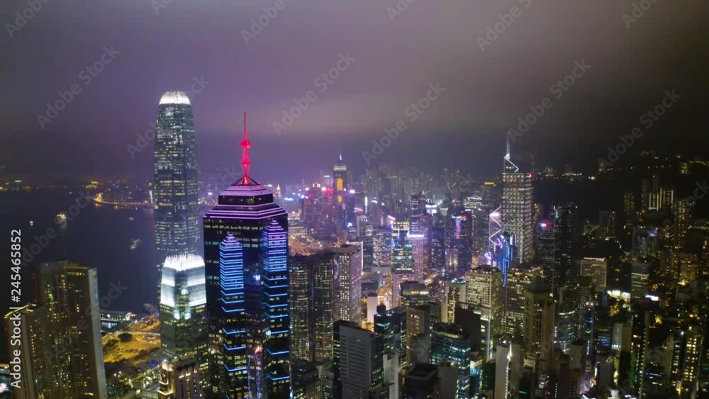 Aerial view from flying drone of Central of Hong Kong at night time. modern skyscrapers and tall edifices of megapolis, urban transportation system. Aerial view from flying drone of Central of Hong Kong at night time. modern skyscrapers and tall edifices of megapolis, urban transportation system.