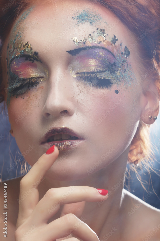 young beautiful woman with colorful bright make-up young beautiful woman with colorful bright make-up