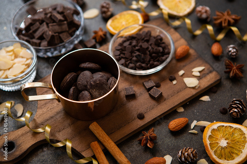 chocolates, ingredients on black table  