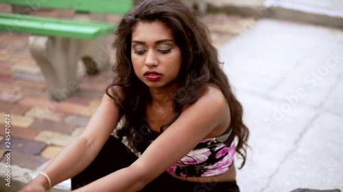 Portrait of ethnic Indian girl in leather jacket and boots for her video diary photo