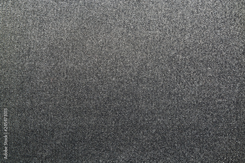 Texture of denim background. Grey jeans