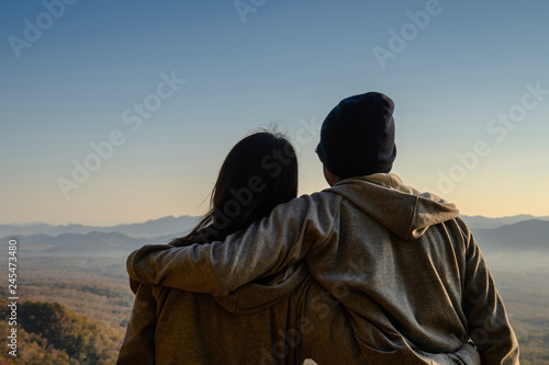 silhouette of a couple on sunrise background in the morning. copy space for text. happiness concept. as valentine's day concept
