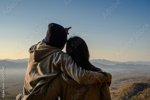 silhouette of a couple on sunrise background in the morning. copy space for text. happiness concept. as valentine's day concept