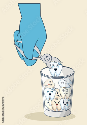 teeth in the glass with dental extractor in the dentist hand