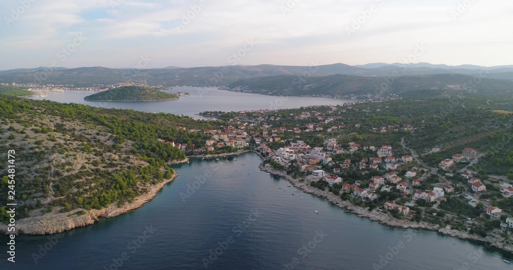 Mediterranean town, C4k aerial, tracking, drone shot, of the Razanj village, on the croatian coast and the turquoise, adriatic sea, on a sunny, summer morning, in Croatia