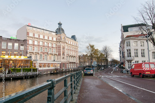 View of Halvemaansbrug bridge along canal in Amsterdam. the Netherlands.