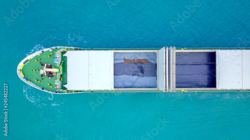 Large Cargo ship loaded with Metal rods anchored at sea - Aerial image © STOCKSTUDIO