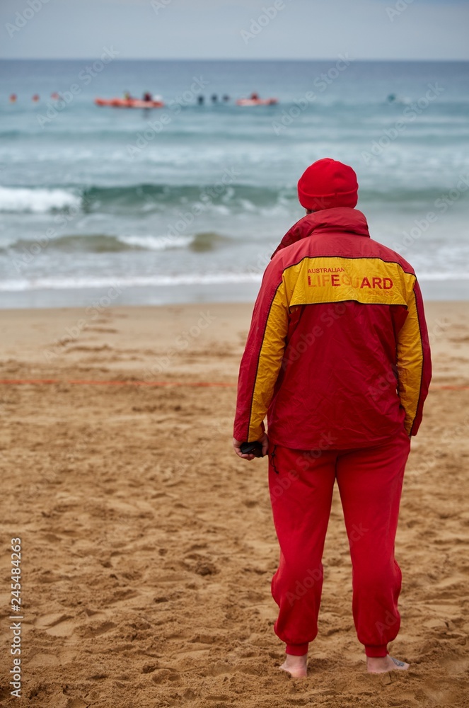 An Australian life guard watches over the beach