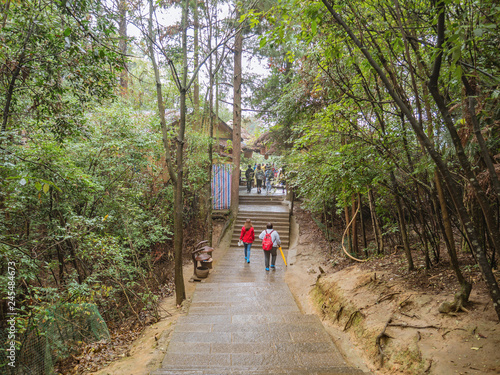 zhangjiajie/China - 14 October 2018: Unacquainted Tourists Walking on tianzi mountain in Zhangjiajie National Forest Park in Wulingyuan District Zhangjiajie City China in the Foggy day.