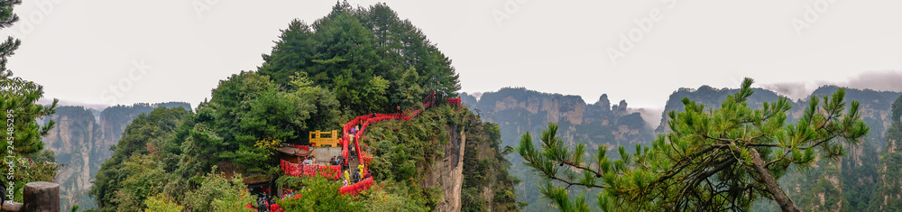 zhangjiajie/China - 14 October 2018: Unacquainted Tourists on Tianxiadiyiqiao tianzi mountain in Zhangjiajie National Forest Park in Wulingyuan District Zhangjiajie City China in the Foggy day. zhangjiajie/China - 14 October 2018: Unacquainted Tourists on Tianxiadiyiqiao tianzi mountain in Zhangjiajie National Forest Park in Wulingyuan District Zhangjiajie City China in the Foggy day.
