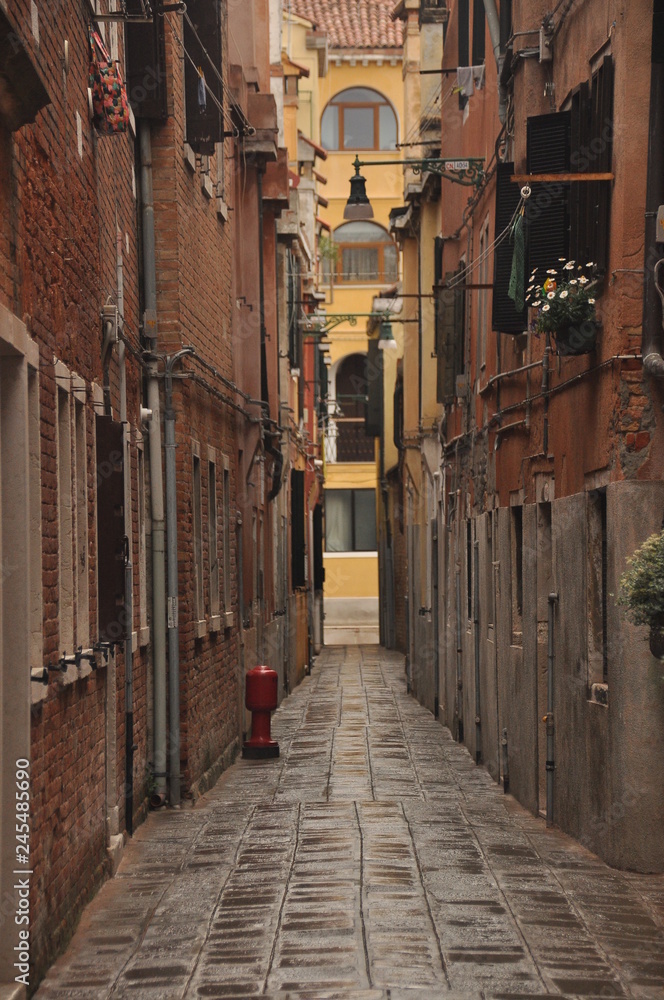 Narrow canals and alleyways in Venice. City of monuments in gondola.
