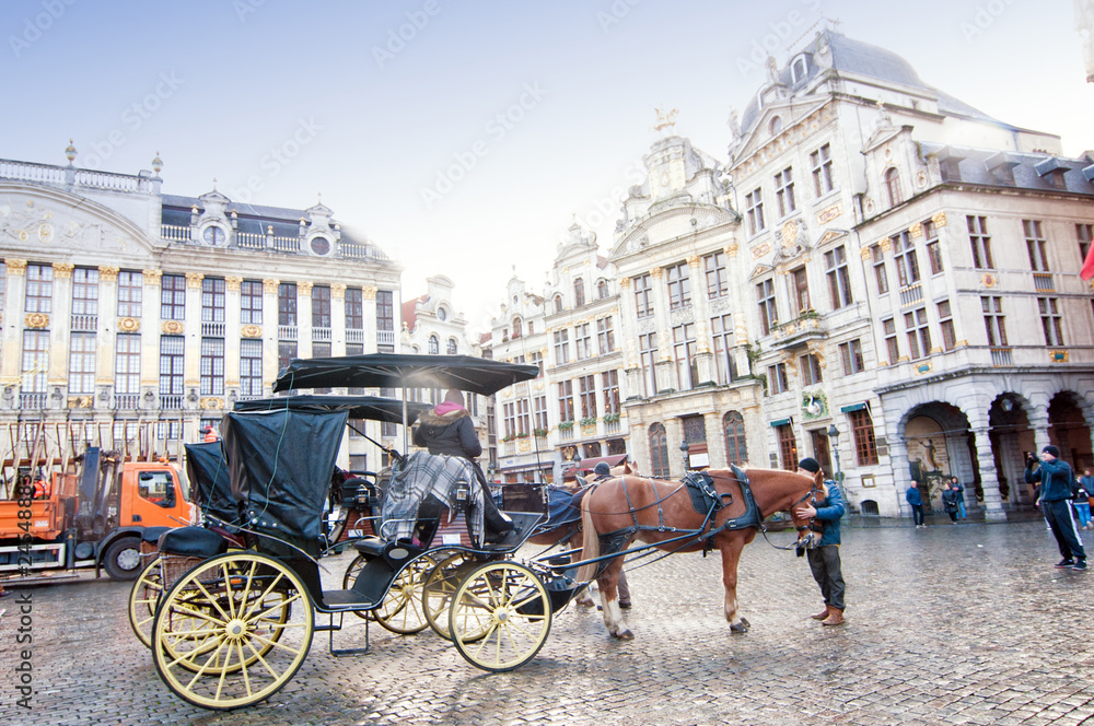 View of The Grand Place or Grote Markt in Brussels, Belgium with tourism carriage.