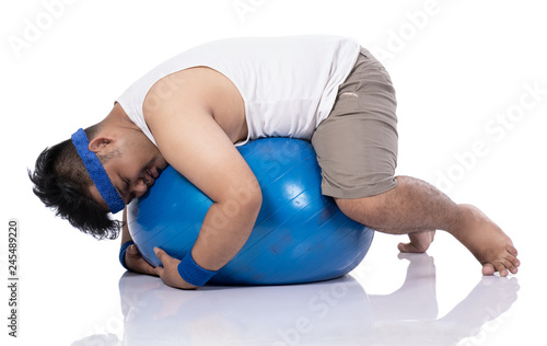 Cuadro en lienzo portrait of fat young men do pilates exercise