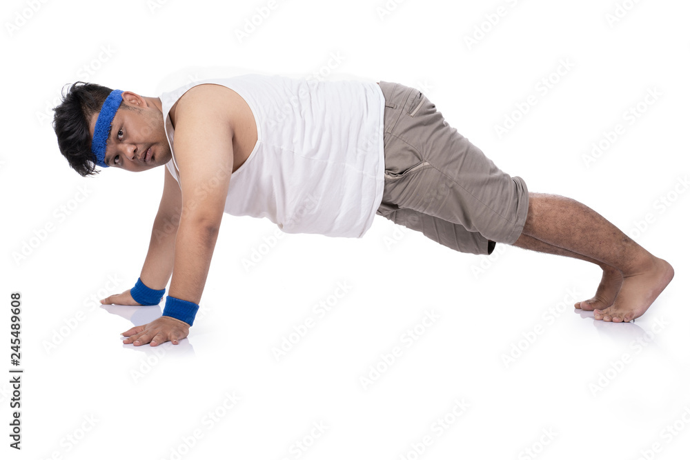 portrait of fat young man try harder doing push up