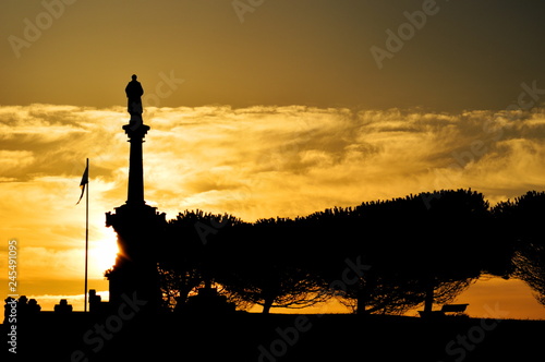 The sun rising over Comillas in a summer morning, Cantabria, Spain	 photo