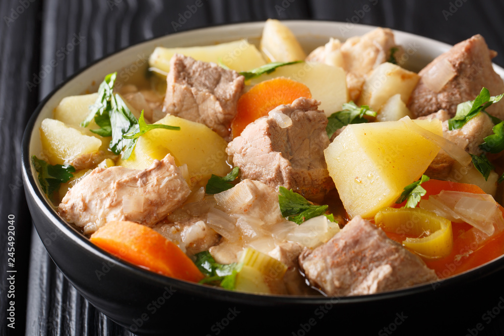 German soup Pichelsteiner or Bismarck stew with vegetables and three kinds of meat close-up in a bowl. horizontal German soup Pichelsteiner or Bismarck stew with vegetables and three kinds of meat close-up in a bowl. horizontal