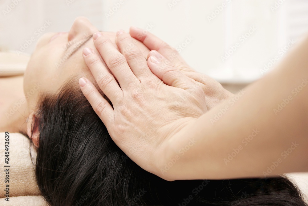 female hands doing head massage female hands doing head massage