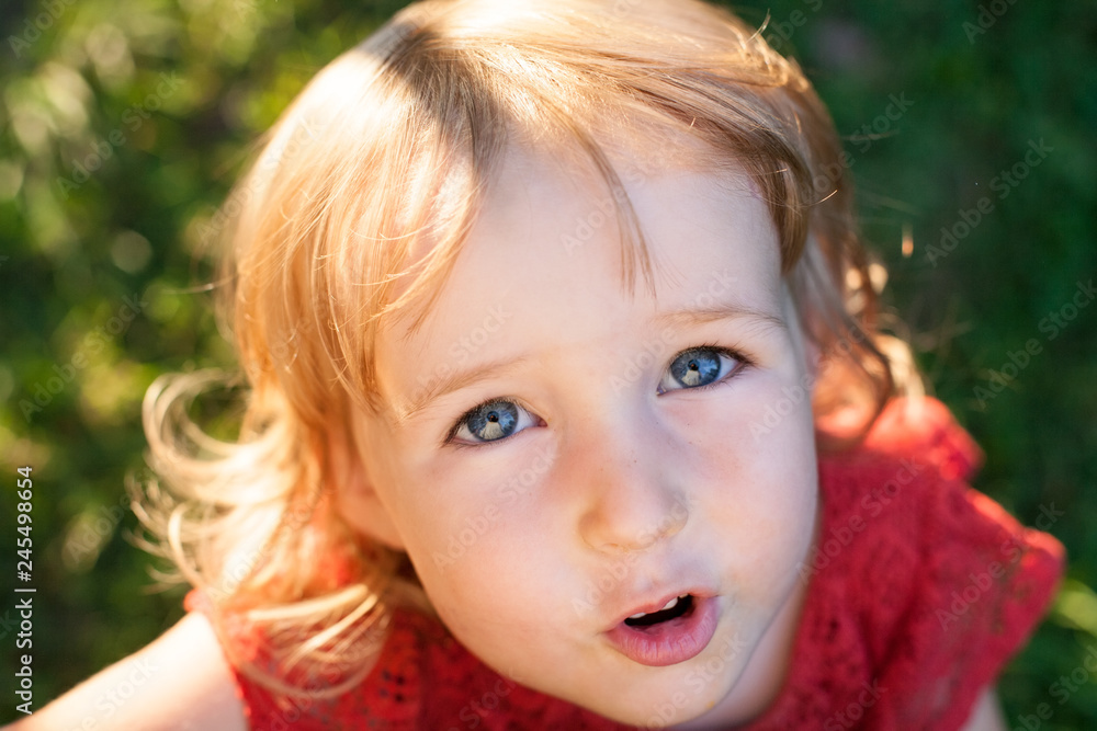 closeup top view of cute little caucasian gilr face closeup top view of cute little caucasian gilr face