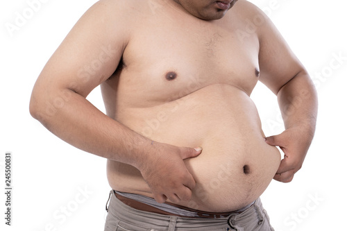 fat young man stressed and pinch excess fat on waist