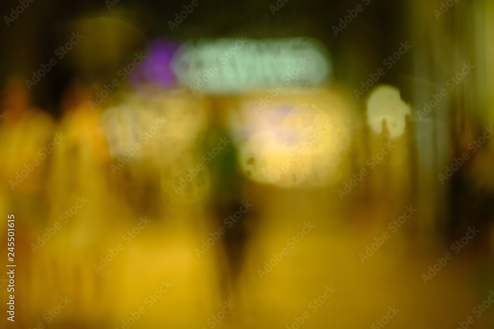 Abstract circular bokeh background of night light with raindrops