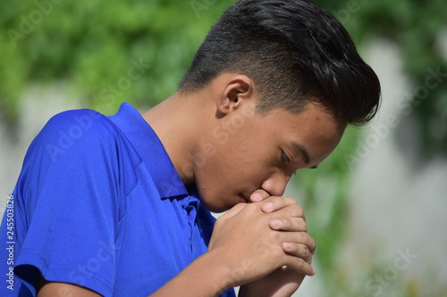 Young Diverse Teenage Male Praying