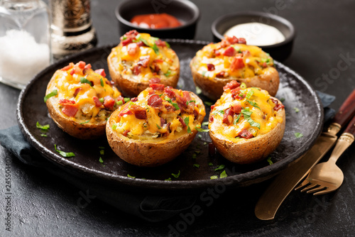 Hot baked potato topped with bacon, green onions and cheddar cheese.