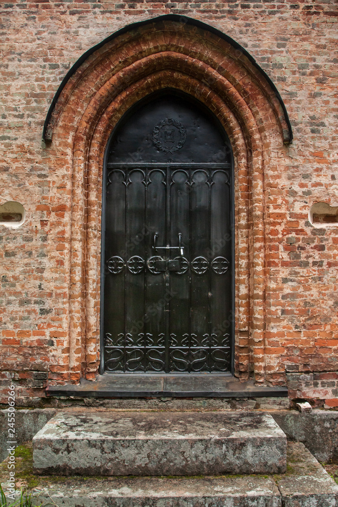 Door of old chapel at cemetery in Finland.