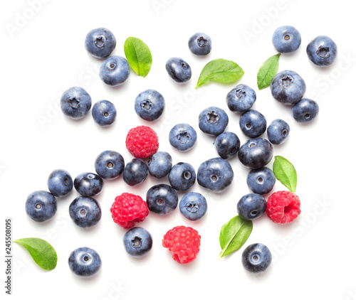 top view of blueberry and rapsberry fruits isolated on white background