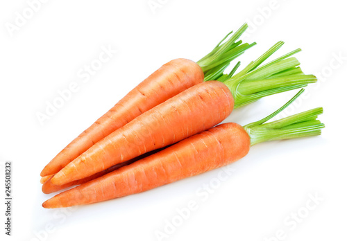 pile of ripe carrots isolated on white background