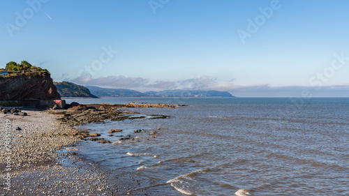 The beach in Watchet, Somerset, England, UK - with Minehead in the background photo