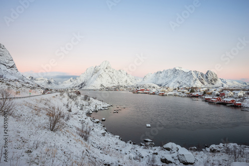 Landscape of dishing house village among the snow with mountain view in Lofoten island Reine Norway