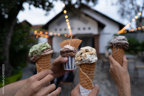 Photo portrait of hands holding ice cream cone on a backyard