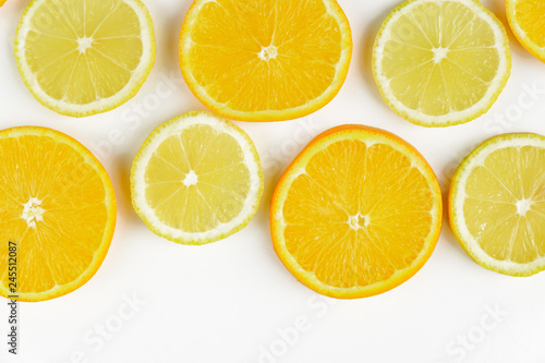 citrus slice, oranges and lemons on white background