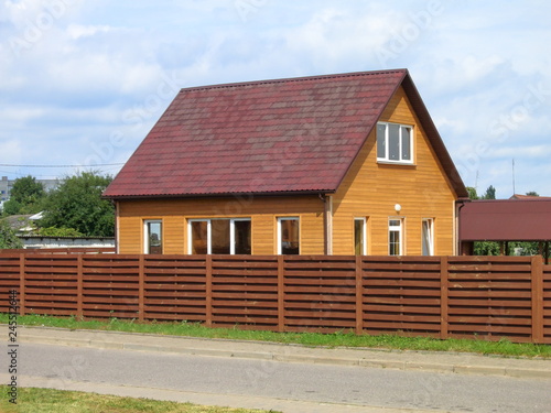 Fototapeta Naklejka Na Ścianę i Meble -  The brown house in the village