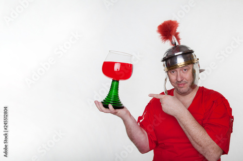 A roman soldier drunk with a glass of wine photo