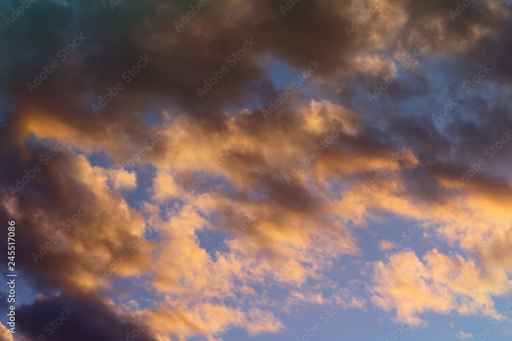 wonderful toned sun colored partially cloudy sky for using in design as background.