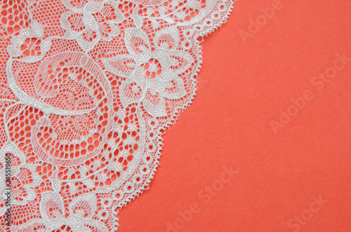 white, beautiful lace on a pink background