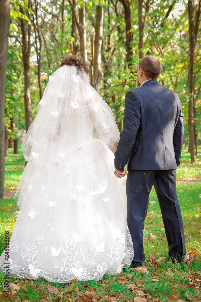 bride and groom in park