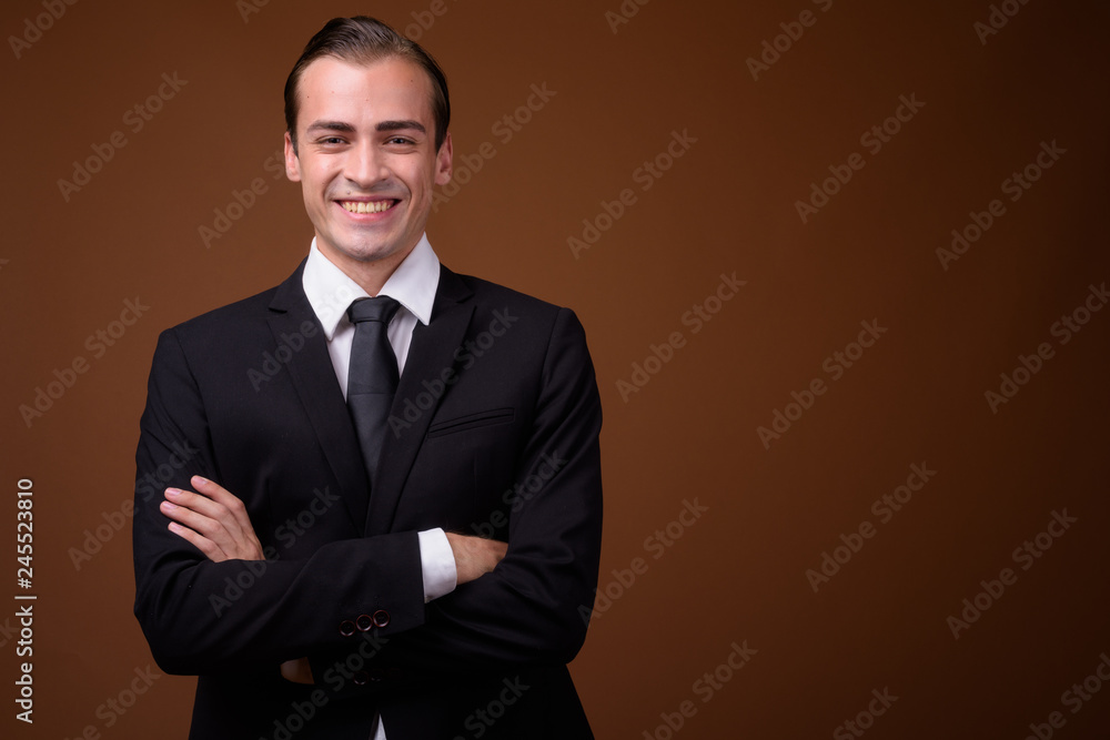 Portrait of young happy Caucasian businessman smiling Portrait of young happy Caucasian businessman smiling