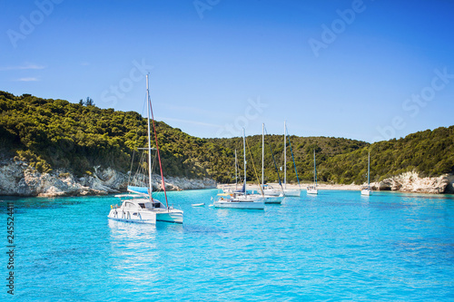 Vacations in Greece. Beautiful bay with sailing boats yachts near the Antipaxos island