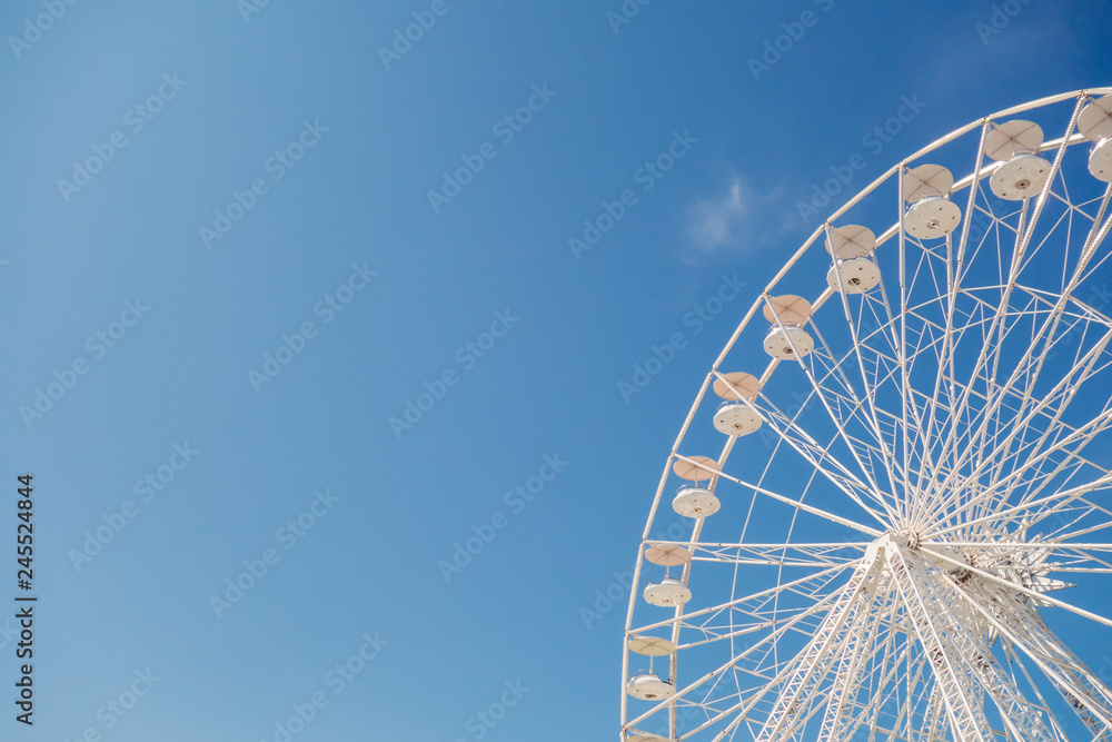 White big wheel against blue sky, copy space