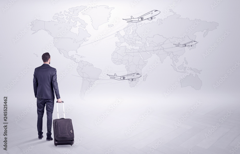 Businessman in dark suit planning his trip in a front of a map
Businessman in dark suit planning his trip in a front of a map
